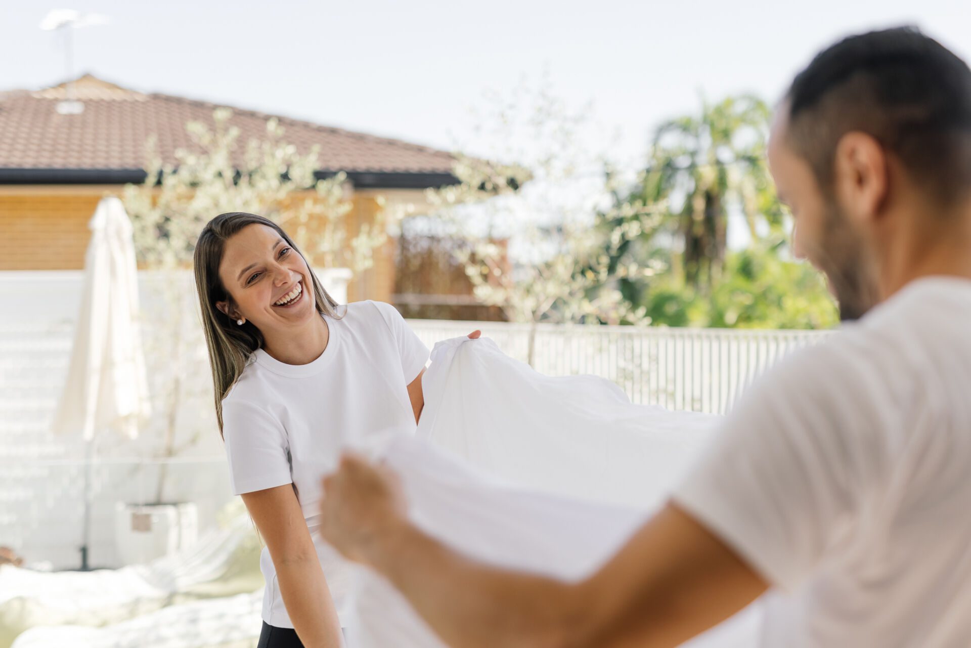Family Clean Home Assistant folding laundry in a bright, tidy Australian home