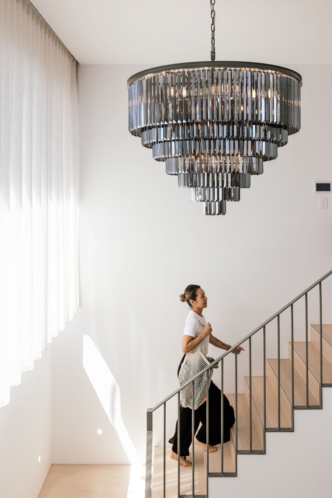 Cleaner walking through Adelaide home.